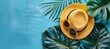 Vivid image of a yellow straw hat and stylish sunglasses resting on a vibrant blue background with tropical leaves