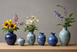 Japanese Ikebana flower arrangements in simple minimalistic Utsuwa Japanese ceramic containers or vases with blue glaze drawings of flowers plants and animals, stunning beautiful exotic flowers like h