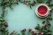 Top view of herbal tea surrounded by pink flowers and leaves.