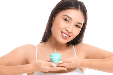 Sticker - Young Asian woman with jar of facial cream on white background, closeup