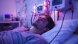 Man resting in a hospital bed with monitors