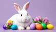 Happy easter. Painted eggs and rabbit on violet
