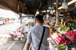 © Alvaro Lavin/Stocksy - Man in street market.
