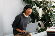 © Studio Firma/Stocksy - Portrait of smiling Asian woman