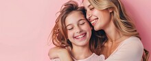 Beautiful Loving Mother And Daughter, Hugging Each Other, Wearing Pink Clothes With A Pink Ribbon, Symbol Of World Breast Cancer Awareness. AI Generated Illustration