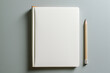 Open blank white bound notebook on a clean workspace with a pencil for writing down ideas