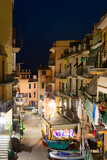 Fototapeta Miasta - View of via Renata Birolli in Manarola, Italy by night. Manarola may be the oldest the second-smallest of the famous Cinque Terre towns.