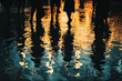 © marishatti - reflection of silhouettes of people and night lights in rippled water