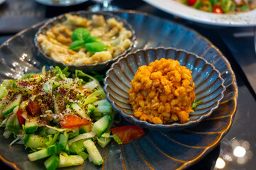 Wall Mural - Vegetarian dishes, mezze in Turkish restaurant, bulgur pilaf, grilles eggplants and fresh vegetables salad