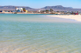 Fototapeta Uliczki - West coast of Fuerteventura island. Winter sea and sun vacation in El Cotillo touristic village, Canary islands, Spain. White sandy beach La Concha..