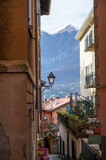 Fototapeta Fototapeta uliczki - Tourist destination small medieval village of Bellagio with hilly narrow streets and luxurious villas, holiday destination on Lake Como, Italy