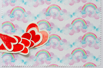 Poster - decorative cloth with rainbows and paper hearts