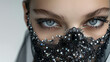 Intense Gaze of a Young Woman in a Bejeweled Black Lace Mask