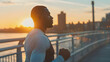 Young african american man is exercising in sunset on the bridge in the city