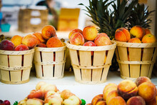 Fresh Peaches In Baskets