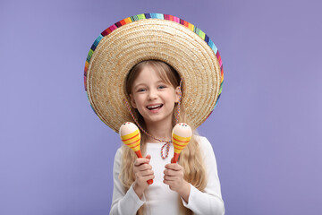 Wall Mural - Cute girl in Mexican sombrero hat with maracas on purple background