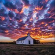 Sunset Sky Over Small Country Church - Dramatic cloud-filled sunset sky over a serene white country church in rural landscape