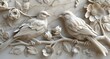 3D carved from marble birds , with flowers and leaves on the background