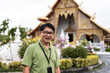 © Alvaro Lavin/Stocksy - Man smiling at temple.