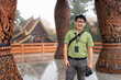 © Alvaro Lavin/Stocksy - Happy man smiling at temple.