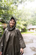 © Alvaro Lavin/Stocksy - Woman enjoying a rainy day outdoors.