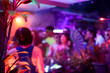 © Luciano Spinelli/Stocksy - Neon color anonymous people enjoying tropical electronic party vibe
