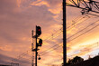 © Heng Yu/Stocksy - Sunset Over Railroad Signals