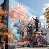 Fototapeta Londyn - A person painting a mural on a building facade. 