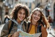 © SHI - Two young ladies on a trip looking at a map, travel concept