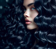 young woman with black and blue curly hair. concept of hair care, coloring, hair extensions.
