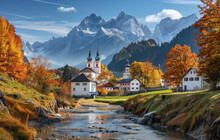 A Picturesque Autumn Scene Of The Idyllic Village In Tirol, With Its White Houses And Colorful Trees, Set Against Rolling Green Hills And Surrounded By Majestic Mountains Under Clear Blue Skies