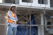 © chachamp - Portrait Worker engineer African woman working with  paper work at construction site