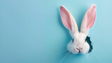 Fototapeta Zachód słońca - Easter bunny ears sticking out of hole on pastel blue background with copy space