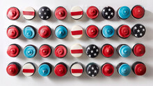 A Meticulously Arranged Assortment Of Red, White, And Blue Cupcakes Forming The Pattern Of The Flag Of The United States Of America, Photographed From Above On A Pristine White Table.