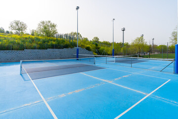 Empty new blue outdoors pickletball and tennis courts