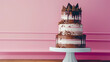 Birthday or wedding chocolate cake on a stand on a pink background.
