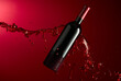 Bottle and red wine splash on a dark red background.