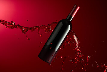 Poster - Bottle and red wine splash on a dark red background.