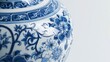 The abstract art on the blue and white ceramic vase in detail. There is only white in the background.