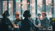 © Oleksandr - A group of call center workers wearing headsets and sitting at their desks