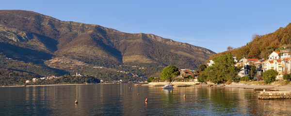 Wall Mural - Beautiful winter Mediterranean landscape. Montenegro, Adriatic Sea . View of coast of Bay of Kotor and Donja Lastva village near Tivat city