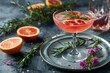 Grapefruit cocktail with rosemary and ice, summer refreshing drink.