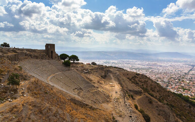 Wall Mural - Ancient Pergamon theater ruins at hill slope with a panoramic view, harmonizing with nature. Aerial view. Bergama (Izmir), Turkey (Turkiye)