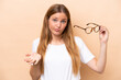 Young pretty blonde woman with glasses isolated on beige background making doubts gesture while lifting the shoulders
