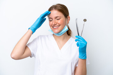 Wall Mural - Dentist caucasian woman holding tools isolated on white background smiling a lot