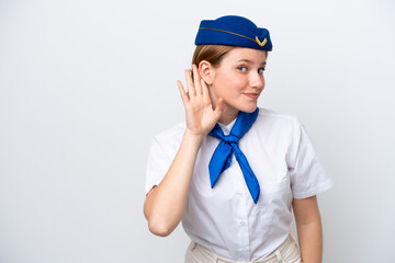 Wall Mural - Airplane stewardess woman isolated on white background listening to something by putting hand on the ear