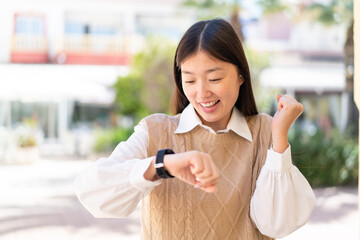 Wall Mural - Pretty Chinese woman with sport watch