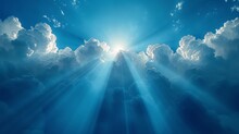 The Sun Shining Through The Clouds In A Blue Sky With Beams Of Light Coming From The Center Of The Clouds.