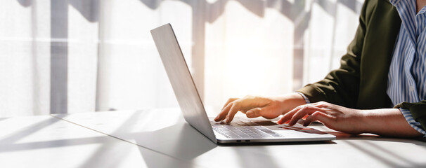 Typing on keyboard Working online on laptop computer On a white table at the office. Facebook chat. Web meeting. Blogger. Journalist writing an article. online job ideas