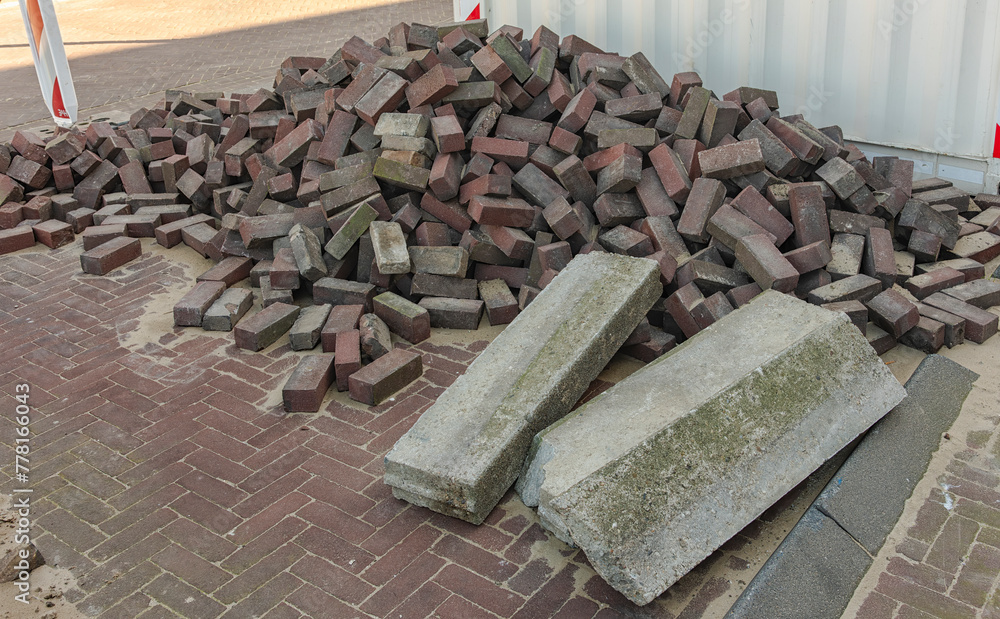lay paving stones and concrete blocks outside on the pile